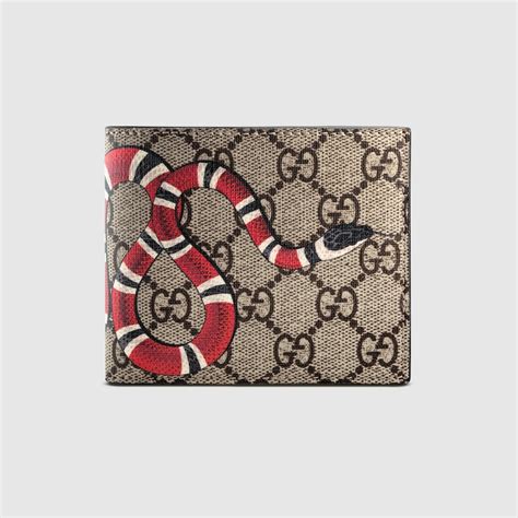 cartera gucci con un broche con una sola g